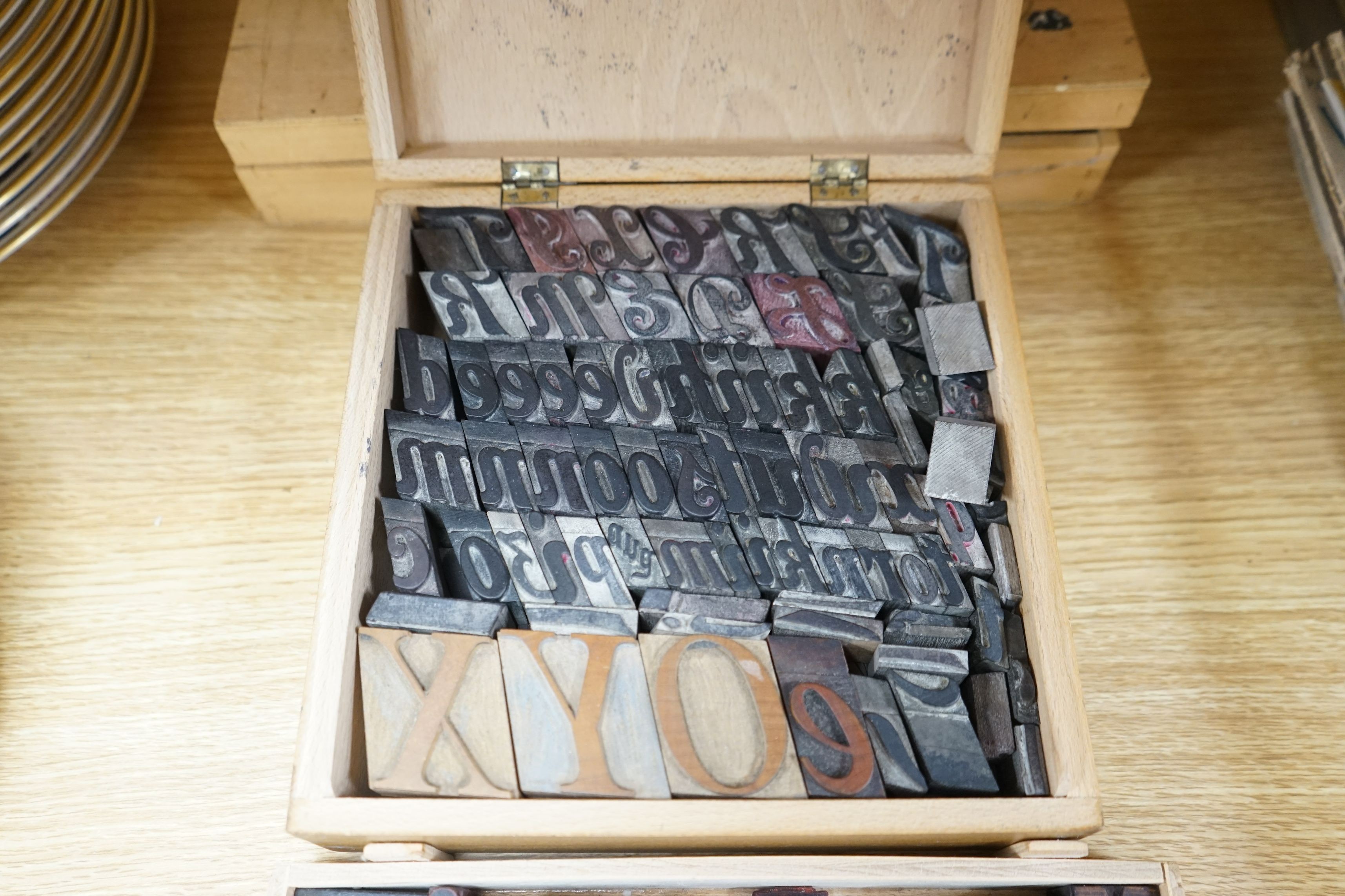 A collection metal letters and boxed printing blocks